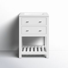 a small white cabinet with drawers on the bottom and one drawer open to reveal something