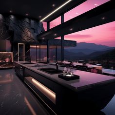 a large kitchen with an island counter next to a window at night and mountains in the background