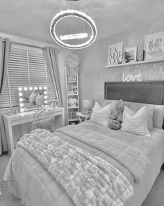 black and white photograph of a bedroom with a large bed