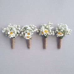 four small bouquets of daisies and baby's breath