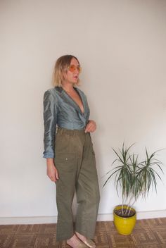 "This item is in GOOD reworked vintage condition! I'm not sure who added the elastic to the waist, but I ain't mad at it! There are some sun spots on the front (pictured,) but no stains or tears that diminish the garment. Pair with a blazer and distressed tee, or pop on a lil crop top!  Tag Reads:  Boy Scouts of America Official Uniform Size 34 Waist 34 Measurements (taken while lying flat):  waist - 28\" to 32\" stretched hips - 40\" rise - 12 1/5\" inseam 27 1/2\" length - 39\" Fit like a modern 6 to 10 Model is 5'7\" - bust 33\" - waist 26-27\" - hips 36.5\" - inseam 30\" and usually wears a size 4.  Something to keep in mind while shopping: while often in great condition, these items are old and subject to flaws. I will always try to list item sizes as thoroughly as possible in the ite Vintage Cargo Pants With Pockets For Summer, Vintage Summer Cargo Pants With Pockets, Vintage Wide Leg Cargo Pants For Summer, Retro Wide Leg Cargo Pants For Spring, 90s High Waist Parachute Pants For Spring, Vintage High Rise Pants For Fall, Vintage Spring Pants With Pockets, Vintage Full-length Cargo Pants For Fall, Vintage Wide Leg Cargo Pants For Fall