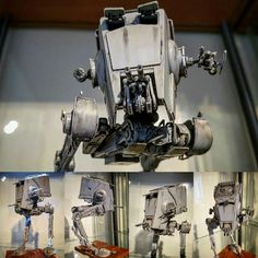 some type of robot that is on display in a glass case with four different views