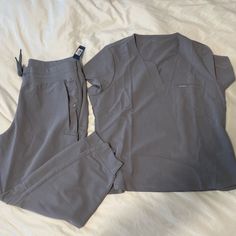 These Scrubs Are A Pretty Light Gray Color! Brand New With The Original Tags. The Top Is A Size Xl And The Bottoms Are A Size Xl Petite. Scrubs Uniform Cute, Jaanuu Scrubs, Scrubs Uniform, Light Gray Color, Scrub Sets, Pretty Lights, Light Gray, Scrubs, Pant Jumpsuit