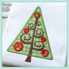 a christmas tree appliqued on a white t - shirt with red buttons