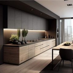 a modern kitchen with wooden cabinets and black counter tops, along with a dining room table