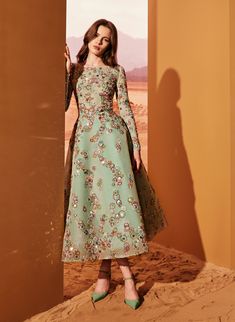 Water Green midi dress, splashed with circular patterns of embroideries from the sheer tulle neckline and cascading on the A-line skirt. Contrasted with a bold belt to flatter the waist.

#TonyWard #FW24 #RTW #FallWinter #SafariSunset Marchesa Couture, Midi Dress Style, Green Midi Dress, Glam Dresses