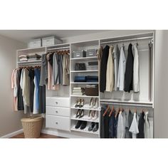 an organized closet with clothes and shoes