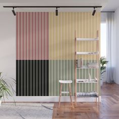 a room with a striped wallpaper and wooden flooring next to a ladder in front of a potted plant