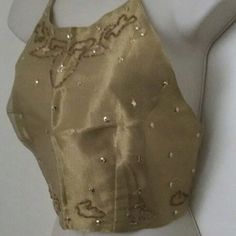 Women's Vintage Rare Beautifully Designed Fashion Gold Fun Reversible Sequins Beaded Sexy Halter Top Size One Size. It Is A Must For The Fashionista. It Will Be Fabulous For The Summer For Parties And Just Having Great Fun. One Side Has Sequins And Beads The Other Side Is A Smooth Soft Silky Like Fabric. Ties At The Neck And Back Waist Area. Very Hard To Find Will Make A Great Gift. Thank You For Looking, Have A Great Day. Glamorous Embellished Fitted Halter Top, Elegant Fitted Halter Top With Sequins, Elegant Fitted Sequin Halter Top, Elegant Embellished Halter Top For Parties, Elegant Fitted Gold Halter Top, Elegant Gold Halter Top For Evening, Embellished Fitted Halter Top, Gold Elegant Sleeveless Halter Top, Elegant Embellished Sleeveless Crop Top