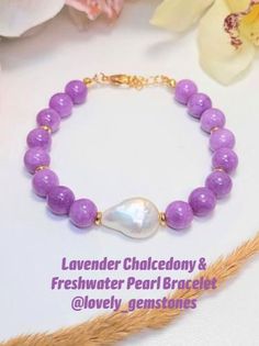 Lavender Chalcedony and Freshwater Pearl Bracelet. This dainty gorgeous purple and white bracelet, would be a perfect bridesmaid gift for Purple Wedding. The lavender and white pastel colors of this bracelet will make happy your Mom, Wife, Grandma or sister for any holiday or Birthday. Please follow us for updates on: Instagram, Pinterest and Tik Tok @lovely_gemstones #freshwaterpearl, #pearlbracelet #lavenderchalcedony #lavenderbracelet #purpleandwhite #goldbracelet #gemstonebracelet White Pearl Jewelry, White Bracelet, Freshwater Pearl Bracelet, Make Happy, Boston Ma, Purple And White, Purple Wedding