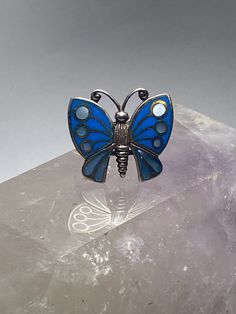 "Butterfly ring mother of pearl sterling silver women girls Size 6.75. Between a size 6.75 and a size 7 Length 7/8\" Width 1\" Thinnest 5/32\" Free Shipping & Free Postal Insurance Delivered in a Gift Box If you do not want the ring polished and want to leave the natural patina please let me know at the time of purchase as I do polish rings before I ship rings out. Thanks Free First Class shipping and postal insurance is included. If you want to upgrade to priority kindly pay an additional f Adjustable Silver Enamel Anniversary Ring, Sterling Silver Butterfly Ring For Formal Occasions, Formal Silver Enamel Ring In Sterling Silver, Silver Jewelry With Inlay For Anniversary, Adjustable Silver Butterfly Ring For Formal Occasions, Silver Enamel Wedding Ring In Sterling Silver, Formal Silver Enamel Rings, Adjustable Silver Enamel Wedding Ring, Silver Inlay Jewelry For Anniversary