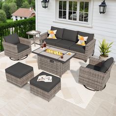 an outdoor patio furniture set with fire pit