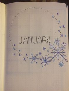 an open notebook with the word january written on it and snowflakes in the middle