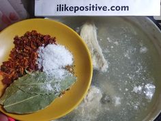 a yellow plate topped with lots of food next to a hand holding a sign that says likepositive com