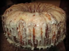 a bundt cake covered in icing sitting on top of a table