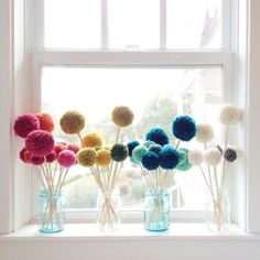 a bunch of flowers sitting in a vase on top of a window sill with the words tutofalfraff diy