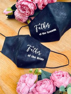 two black face masks with the words father of the bride and father of the groom on them