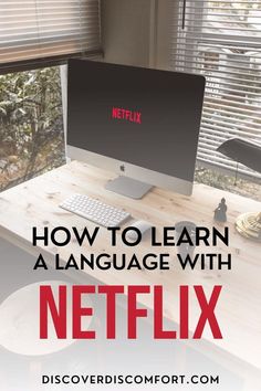 a computer on a desk with the text how to learn a language with netflix