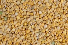 a pile of yellow and green lentils