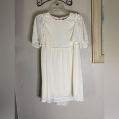 Women’s Show Me Your Mumu Brooks Baby Doll Mini Dress Cream $158.00 Size Small Measurements Are Appropriate Shoulder To Shoulder;14 Inch Bust; 19 Inch Front Length;29 Inch Back Length 32 Inch Tags;Wedding,Bridesmaid,Ceremony,Graduation,Garden Party,Shabby Chic,Cottagecore,Birthday,70’s,Minimalist,Babydoll,Bohemian White Flutter Sleeve Mini Dress For Party, White Fitted Dress With Flutter Sleeves, Fitted Flutter Sleeve Dress For Baptism, Fitted Flutter Sleeve Baptism Dress, Cream Flowy Flutter Sleeve Dress, Cream Flowy Dress With Flutter Sleeves, Flowy Cream Dress With Flutter Sleeves, Cream Flutter Sleeve Dress For Brunch, Off White Short Sleeve Mini Dress With Ruffles