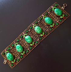 Max NEIGER vintage bracelet in gold metal, enamel, molded glass Party Jewelry With Jeweled Enamel, Antique Enamel Bracelet Collectible, Antique Enamel Bracelets For Formal Occasions, Formal Jeweled Enamel Jewelry, Antique Enamel Bracelet For Formal Occasions, Antique Gold Enamel Bracelets, Vintage Enamel Jewelry For Parties, Antique Green Handmade Bracelet, Vintage Green Decorative Jewelry