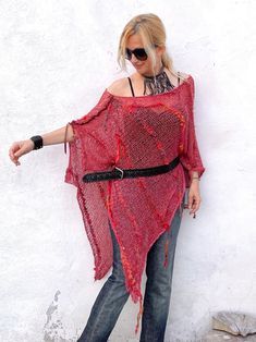 This boho cotton blend hand-knitted fringed poncho in corral pink is light and airy. It is a four-season piece and is ideal for layering  The colour palette is definitely jeans friendly.  STYLE This dressy/casual piece is an excellent travel companion.  Works well with jeans, leggings, swimsuit or over a solid dress adding a flowy elegance of a shawl. Endless in its versatility and fits most sizes make it a great gift idea. Material: Cotton Blend WAYS TO WEAR SEE FAQ's FOR WAYS TO WEAR AS A SHAW Knitted Shawl, Fringed Poncho, Bohemian Festival, Scarf Fashion, Festival Clothing, Knitted Tops, Jeans Leggings, Shawl Scarf, How To Wear Scarves