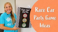 a girl holding up a race car party game