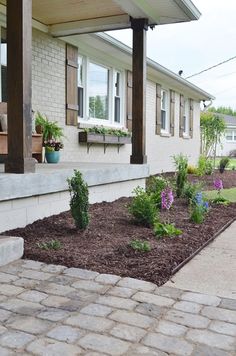 the front yard is clean and ready to be used as a flower bed for plants