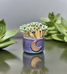 This matchstick or toothpick holder was handmade on a wheel. It's approximately one inch tall by one inch wide. You can use the crescent moon on the front as a match striker. Will only work with strike anywhere matches. You can find strike anywhere matches online or at your local hardware store. Add some match to your spiritual space or altar with a crescent moon matchstick striker. Matchstick Holder, Clay Matches Holder, Clay Match Holder, Ceramic Match Holder, Pottery Match Holder, Ceramic Match Holder With Striker, Match Holder With Striker, Match Striker, Clay Diy Projects