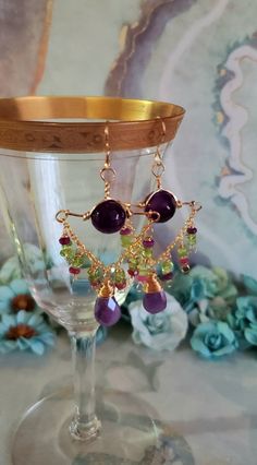 "Beautiful Green Peridot ,Purple Moonstone and Purple Agate and 14k Gold Filled Chandelier Earrings. These Earrings have wonderful Dangle and movement. These Earrings Measure approximately 3\" inches long by 1 3/8\" inches wide. Large Purple Moonstone Briolettes gemstones Dangle with Green Peridot, Purple Faceted Jade Rondelles, wire wrapped with 14K Gold Filled Wire. Below the French Earring wire is a 12mm beautiful Purple Agate. The Moonstone Brio;ettes are approximately 16mm ;ong x 10mm wide. Gold Multi-stone Chandelier Earrings As Gift, Gold Multi-stone Chandelier Earrings For Gift, Gold Amethyst Dangle Chandelier Earrings, Purple Chandelier, Pretty Accessories, Earring Wire, Purple Agate, Earrings Purple, Green Peridot