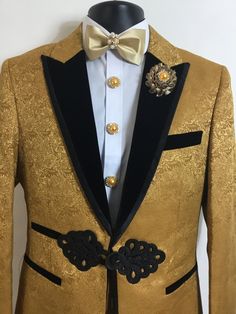 Our new gold, floral print, three piece tuxedo will be an excellent addition to your formal wardrobe. It's luxurious velvet collar will sport a look of elegance that all will notice. This tuxedo includes beautiful button covers, matching cufflinks, and a stunning bow tie. Luxury Velvet Party Blazer, Luxury Velvet Blazer For Parties, Luxury Velvet Blazer, Party Velvet Tuxedo With Suit Collar, Velvet Party Tuxedo With Suit Collar, Velvet Tuxedo With Suit Collar For Party, Elegant Velvet Tuxedo With Long Sleeves, Gold Blazer With Suit Collar For Formal Occasions, Luxury Velvet Tuxedo For Evening