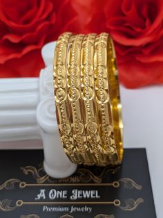 Indian bollywood fashion gold plated 4pcs bridal wedding bangles set These are high quality gold plated bangles set. Have done gold plating on it for a brilient shine. These looks great when you worn in pair or set. They are sure to make your hands look beautiful. A popular combo to wear with many outfits. A perfect gift for your loved ones or yourself.  A perfect ornament for wedding, parties or any special event.  Main Colour: Gold Bangles Sizes: 2.2 / 2.4 / 2.6 Product colour may slightly var Luxury Bangle For Festive Occasions And Receptions, Wedding Choora, Wedding Bangles, Bangles Set, Bracelet Wedding, Gold Plated Bangles, Wedding Parties, Indian Bollywood, Bangle Set