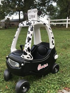 an inflatable toy car with a cow print on the front and back seat