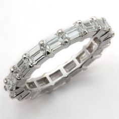 a white gold ring with baguettes and diamonds