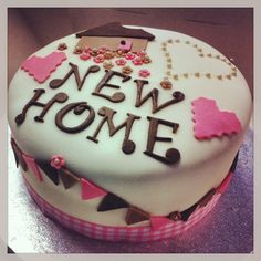 a decorated cake with the words new home on it