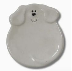 a white plate with a bear face on it