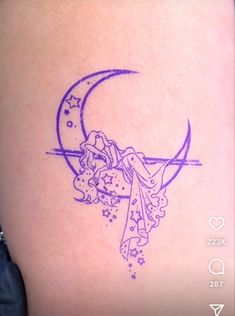 a tattoo on the back of a woman's stomach with a crescent and stars