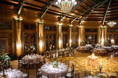 a large room with tables and chairs set up for a formal function in the center