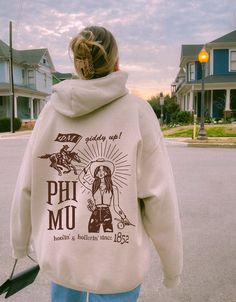 Soft, cute, and trendy, this Phi Mu hoodie will quickly become your go-to cozy sweatshirt! Use the drop down to specify preference between white, sand, sport grey, gold, light blue, or light pink. LISTING IS FOR PHI MU. Please be sure you are ordering for your correct Sorority.  We print on high quality, soft, & heavyweight materials, sustainably made and printed in the US. ♥ SIZING ♥ Unisex Sizing- For a more feminine, fitted look we recommend getting your size. For a more oversized look, we recommend sizing up. ♥ SHIP TIME ♥ Items may take up to 7 business days to process before shipping. Shipping time is (on average) an ADDITIONAL 2-5 business days. Shipping times vary for many reasons, but is largely influenced by your location. ♥ CARE INSTRUCTIONS ♥ Wash garments inside-out, with simi Alpha Chi Omega Merch, Alpha Chi Omega Sweatshirt, Sorority Sweatshirts, Tri Sigma, Big Little Gifts, Kappa Alpha Theta, Alpha Sigma Alpha, Alpha Chi Omega, Alpha Chi