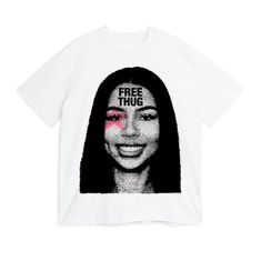 a white t - shirt with the words free thu on it and a woman's face painted in pink