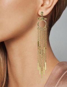 "Metal Tassel Fringe Long Dangle Drop Earrings Available Finished Colors : Gold, Silver, Rose Gold This pair of long fringe tassel earrings are classy, stylish and gives a chic look. These Earrings have intricate design, followed by beautiful chains of fringe tassel. Add some sparkle to your outfit with these earrings and feel like a diva! Unique and Beautiful Dangle Earrings A Must Have Jewelry Accessory For Your Collection. Reasonable Prices Designed in NY CITY Measurement: Approx: 5\"(L) Weig Elegant Metal Tassel Earrings With Fringe, Elegant Tassel Earrings With Dangling Charms For Party, Elegant Party Tassel Earrings With Dangling Charms, Chic Dangle Tassel Earrings For Pierced Ears, Long Drop Fringe Tassel Earrings, Linear Tassel Dangle Earrings, Chic Tassel Earrings, Chic Dangle Tassel Earrings, Must Have Jewelry