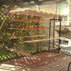 a caged in area with a table and chairs