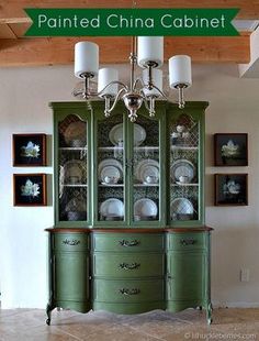 the china cabinet is painted in green