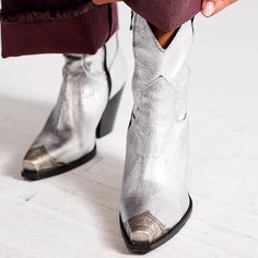 Introducing our stunning Silver Metallic Booties! With an etched metal toe design and a Western-inspired silhouette, these boots are a perfect combination of style and edgy sophistication for women. Color: silver Heel Type: chunky heel Heel height: 3.5 inches/ 8.9 cm Toe: closed toe Zipper design makes it easier to wear on Handcrafted US sizing. Fits true to size. What To Wear With Silver Boots, Boots For, Western Boots For Women, Silver Heel, Cowboy Shoes, Fav Place, Dance Heels, Pointy Toe Heels, Boots Square Toe