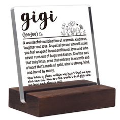 a wooden stand with a plaque on it that reads gigi see - jee n