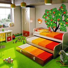 a child's bedroom decorated in orange, yellow and green with an apple tree painted on the wall