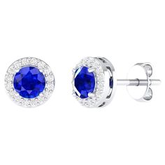 Indulge in the allure of understated luxury with our 18 Karat White Gold 0.96 Carat Sapphire Solitaire Stud Earrings—a testament to the artistry and refinement that defines our collection. Crafted with precision and passion, each piece is a unique manifestation of timeless elegance. The solitaire design is a celebration of simplicity and sophistication. The meticulously chosen White gold enhances the gem's natural beauty, providing a harmonious backdrop that elevates the overall aesthetic. These White Gold Platinum Gemstone Earrings, Platinum White Gold Earrings With Gemstone, Luxury Formal Cluster Earrings With Halo Design, Formal White Gold Sapphire Diamond Earrings, Luxury Cluster Earrings With Halo Design For Formal Events, Luxury Cluster Earrings With Halo Design For Formal Occasions, Formal Luxury Halo Earrings, Formal Sapphire Earrings With Brilliant Cut, White Gold Diamond Earrings In Platinum