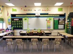 an empty classroom with desks and chairs