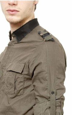 Military style provides a constant source of inspiration for Balmain and this khaki-green shirt is infused with utilitarian details Roll-up sleeves. A satin collar and matching striped epaulettes Deconstructed hidden button-down collar Double patch button-flap pockets Double-button barrel cuffs Shoulder yoke at vertical seaming at back shirttail hem . Cotton Machine wash Made in France Color: green Pit to Pit: 22.5" Waist: 44" Shoulder to Shoulder: 18" Length from shoulder: 31" Khaki Military Collared Shirt, Khaki Collared Military Shirt, Khaki Collared Tops With Cargo Pockets, Green Military Style Work Tops, Green Military Style Workwear Top, Green Military Style Tops For Work, Military Green Shirt For Fall, Military Style Collared Shirt For Fall, Fall Military Collared Shirt