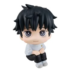 an anime figurine with black hair and blue eyes sitting on the ground,